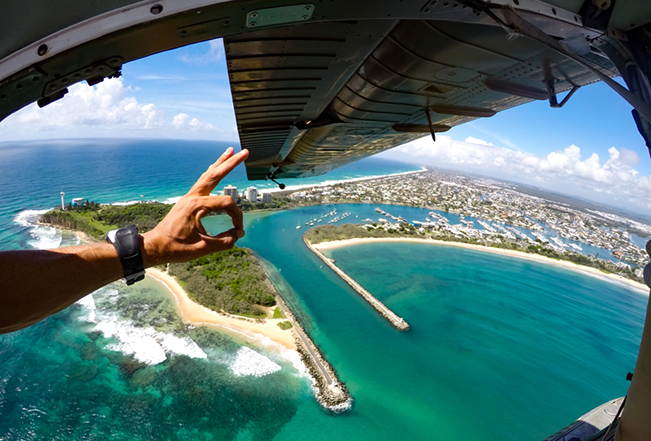 ok sign and view of point cartwright on sunshine coast through open door of paradise seaplane